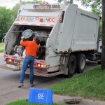 Sanitation Department employee at work in 2012.  His job and nea