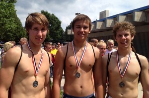 Ruben Weaver, Kenyon Brown, Tony Boster pose with their medals after winning the 2012 triathlon team division.