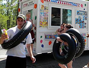 Kids enjoy ice cream from an ice cream delivery truck in Mason City in July of 2012.