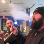 Rick Pierce of Mason City takes a healthy puff from his electronic cigarette in 2012 while enjoying a beverage at Burke's Bar in Mason City.