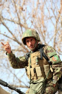 Captain Abdul Hadi, commander of 2nd Tolay, 1st Kandak, 2nd Brigade, 215th Corps, and a native of Takhar province, coordinates with his soldiers in an effort to prepare them for the days tasks during Operation New Hope, Kajaki, Afghanistan, Jan. 17. During the three-day operation, more than 100 Afghan National Army soldiers along with various Afghan National Security Forces elements cleared weapons caches, improvised explosive devices and enemy fighting positions from the area. Accompanying the ANA were 18 Marine advisors providing call for fires and tactical input when needed. Afghan National Security Forces localized their efforts to Kajaki Sofala, part of the southern green zone in Kajaki and a known insurgent hotbed in the district.