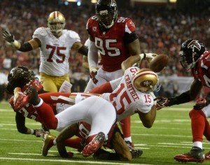San Francisco 49ers wide receiver Michael Crabtree (15) fumbles at the goal line which was recovered by Atlanta Falcons outside linebacker Stephen Nicholas (54) during the second half of the NFC Championship game at the Georgia Dome in Atlanta on January 20, 2013. UPI/Richard Hamm