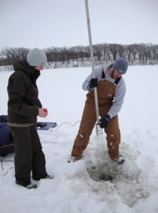 ISU graduate student Adam Heathcote and undergraduate assistant Kelli Rae Soll collect a sediment core from a lake in northwestern Iowa.  Courtesy of John Downing.