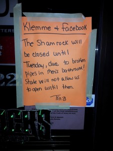 A note on the door of the Shamrock bar in Klemme, posted on top of a notice from the Dept. of Inspections and Appeals.