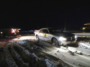 Iowa State Trooper getting towed out of snow drift on Apple Ave