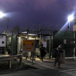 Soldiers exit a sally port after completing a 12-hour shift at Camp Delta, Guantanamo Bay. UPI/Michael R. Holzworth/U.S. Air Force