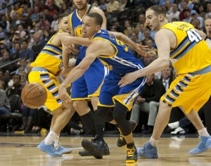  Golden State Warriors guard Stephen Curry (C) loses the ball driving pasat Denver Nuggets center Kosta Koufos in the fourth quarter during the First Round Playoffs Game One in Denver on April 20, 2013.  The Nuggets take a 1-0 series lead defeating the Warriors 97-95.     UPI/Gary C. Caskey