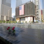 Flowers are placed above the names of the victims of 9/11 that are engraved on the Memorial Pools as the 9/11 Memorial opens to the public one day after the tenth anniversary of the terrorist attacks on the World Trade Center on 9/11 at Ground Zero in New York City on September 12, 2011.   UPI/John Angelillo