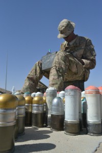 Spc. Jeramie Thibodeaux, a Dallas, Texas, native assigned to the 63rd Ordnance Company, Task Force Provider, inspects and sorts various 40-mm rounds at the ammunition supply point, July 5, at Kandahar Airfield, Afghanistan. (U.S. Army photo by Spc. Rochelle Krueger, 3rd Sustainment Brigade Public Affairs)