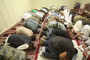 Afghans pray before the Iftar dinner at the Afghan Cultural Center at Camp Leatherneck, Afghanistan, July 25. The Iftar dinner was a chance for coalition and Afghan leaders to socialize during the Islamic holy month of Ramazan.