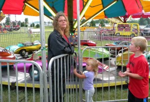 Mattie Borchardt charming the Lady Carnival Worker into a free ride
