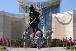 FAYETTEVILLE, N.C. – Fort Bragg Paratroopers salute during a wreath laying ceremony in front of the downtown Fayetteville Airborne and Special Operations Museum in honor of fallen Paratroopers during the National Airborne Day celebration, Aug. 24. The event marks the 11th observance of the day President George W. Bush proclaimed Aug. 16, 2002, the day to nationally recognize the U.S. Army’s first airborne operation 63 years ago. It was also an opportunity for family members to gain an understanding of what their Paratroopers do. (U.S. Army photo by Staff Sgt. Nancy Lugo, 82nd Airborne Division Public Affairs)
