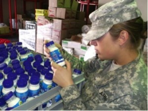 U.S. Army Spc. Rachel Kirkey of the 445th MDVS inspects fresh milk in accordance with the parameters of the food safety regulations.