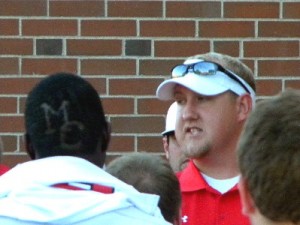 Mohawk football coach with players
