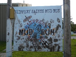 Most of the runners added their muddy handprints to the sign and poles