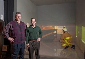 Nir Keren, left, and Warren Franke, center, have conducted research on firefighter stress levels using virtual reality simulations. Larger image. Photo by Robert Elbert.