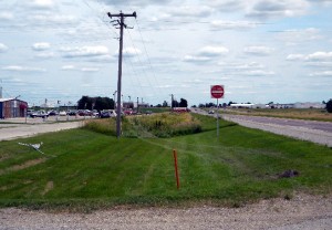 Subject drove over road sign and drove through high weeds hitting power  pole