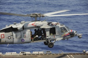 An MH-60S helicopter assigned to Helicopter Sea Combat Squadron (HSC) 6, aboard USS Nimitz (CVN 68).