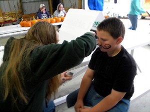 Nick McKinney getting his face painted