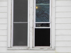 Upstairs window broken where it was said that things were being thrown from