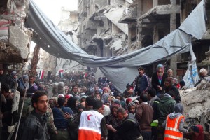 Desperate crowd awaits relief aid at Yarmouk Palestinian refugee camp in Damascus. Photo: UNRWA