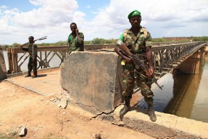 African Union troops guard a bridge over the Juba river near the town of Burdubow which they regained control of from Al Shabaab insurgents on 9 March 2014 during a joint operation with Somali National Army troops. Photo: AU/UN/IST/Mahamud Hassan