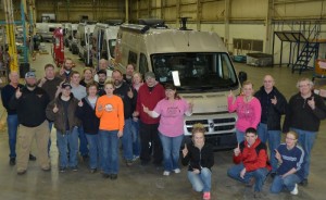 Winnebago employees celebrate the first Travato to be completed in the new Lake Mills Assembly Facility.  (PRNewsFoto/Winnebago Industries, Inc.)