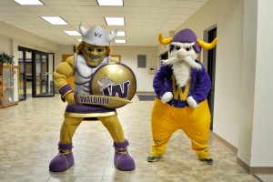 New mascot, Warrick, and old mascot, Wally, pose together during Waldorf homecoming event 2013
