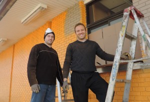Kelmendi brothers work on the exterior of the building at 1303 South Federal Avenue