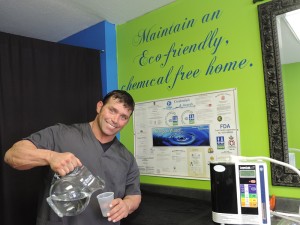 Chad Wicks, owner of Wonder Water store, pours up another glass of crystal-clean H2O
