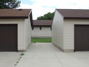 Councilman Travis Hickey's garages, never connected as a Mason City board ordered, 4 years ago.  He voted in favor of demolishing Mr Flinchum's house.