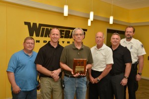 Shown in the photo with the award is Winnebago Industries’ Safety Committee:  (left to right) John Breuklander, Al Heimdal, Pete Visser, Terry Rodberg, Daryl Krieger, and Dan Larson.  Missing from the photo are committee members: Barry Bendickson, Colleen Bagley and Merle Clement.