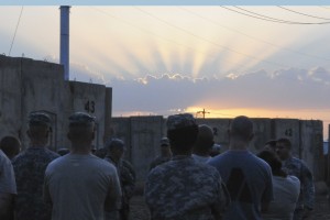Members of the 1-151st Attack Reconnaissance Battalion gather at sunset on Camp Taji, Iraq, Nov. 20, 2011.