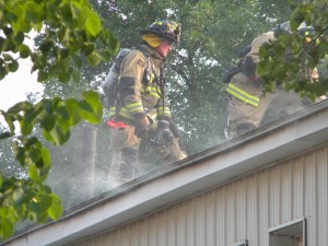 Investigating source of smoke at apartment house