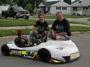 Lucas with his dad, Kevin, and his kart