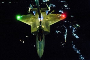 An U.S Air Force KC-10 Extender refuels an F-22 Raptor fighter aircraft before strike operations in Syria, Sept. 26, 2014. These aircraft were part of a strike package engaging targets against the Islamic State of Iraq and the Levant. U.S. Air Force photo by Tech. Sgt. Russ Scalf 