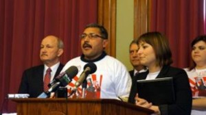 Valentine Ruiz of Conesville tells a Statehouse news conference of his ongoing fight to be paid for $1,200 of welding work he did in 2012 for a West Liberty company. Iowa Workforce Development sought and won a judgment for back pay and interest. However, no penalty was imposed and Mr. Ruiz has yet to receive any of the money owned him. A estimated $600 million is stolen from Iowa workers each year. Senate Democrats are working to toughen Iowa?s wage theft laws. From left to right: Senator Bill Dotzler of Waterloo, Mr. Ruiz, Senator Tony Bisignano, Misty Rebik of the Center for Worker Justice of Eastern Iowa and Katie Wilson, a wage theft victim from Iowa City. (1/27/15) 