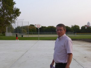 Volunteer Chris Watts stands by as Antonio Ramon shoots some hoops Wednesday evening