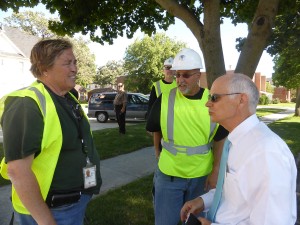 FEMA official Barbara Sturner and newly-elected city councilman Bill Schickel discuss the Egloff House move Monday afternoon in the Cultural Crescent