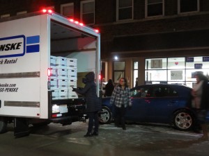 Saturday night, Hillary Clinton workers unload boxes with contents they refused to discuss