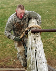Spc. Dakota Austin VanBrocklin, a Dubuque, Iowa, resident and combat medic with the 134th Medical Company (Ground Ambulance), 109th Multifunctional Medical Battalion based at Camp Dodge, climbs an obstacle during the Iowa Army National Guard Best Warrior Competition at Camp Dodge, Johnston, Iowa on March 19. VanBrocklin placed first out of nine privates first class and specialists competing for the Soldier of the Year title over three days of grueling challenges testing the Soldiers’ physical, mental and professional skills. (Iowa Army National Guard photo by Sgt. Zachary Zuber)