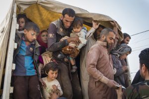 Internally displaced persons flee to Debaga camp in Erbil Governorate, northern Iraq, as Mosul assault begins. Photo: UNHCR/Ivor Prickett