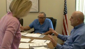 Human Rights Commissioner Jackie Huesman stood up and left Thursday's Human Rights Commission meeting as the issues heated up.