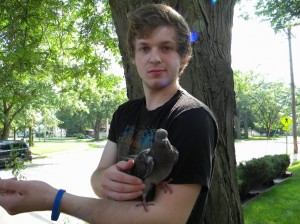 Pigeon finds a safe place in James's arm